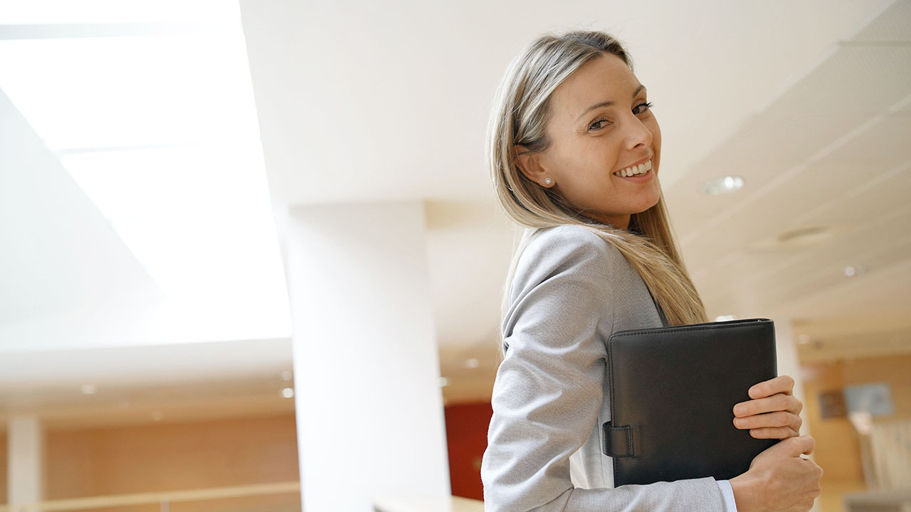 Female smiling in a bright office room